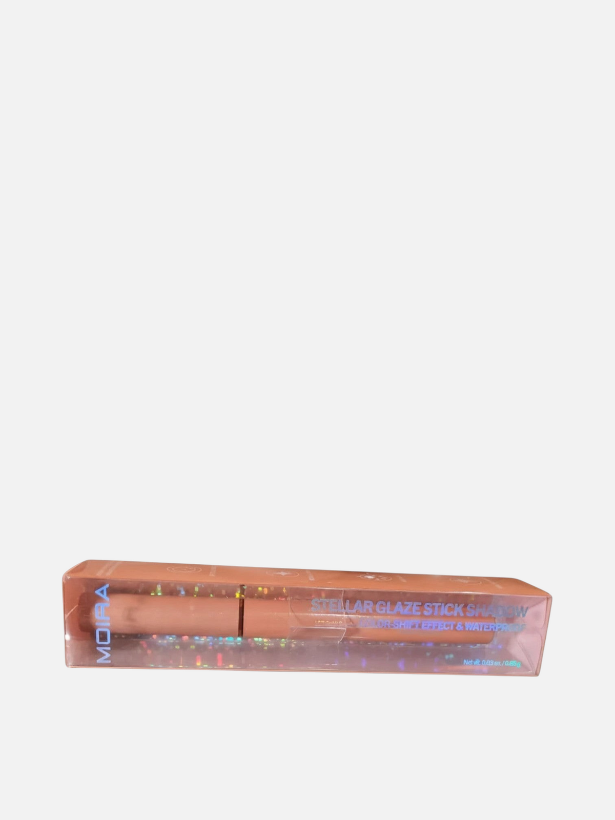 Sombra en barra MOIRA Stellar Glaze Stick Shadow de Accesorios by Alexsa en su empaque original con efecto holográfico.
