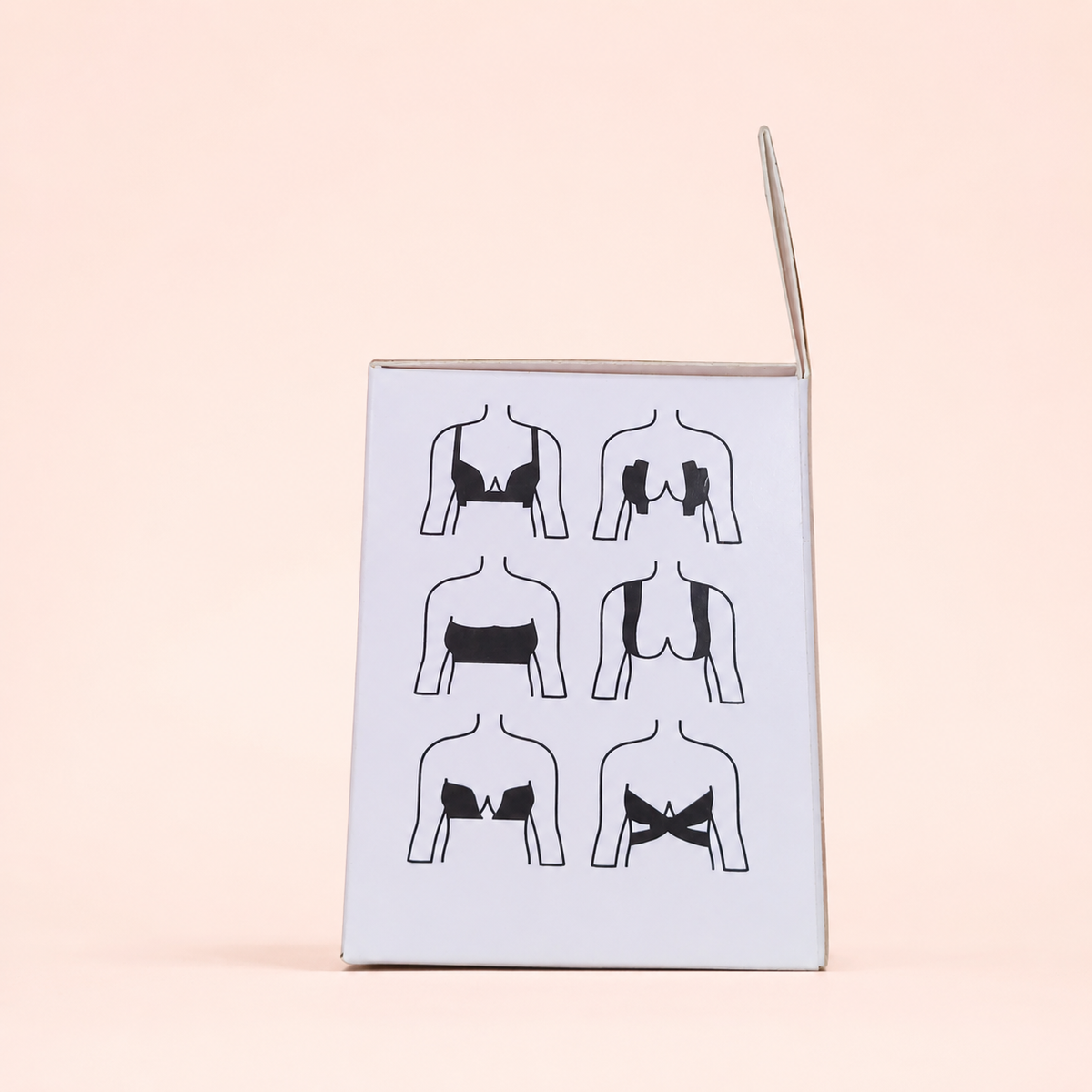 Body Tape, lateral del empaque con instrucciones sobre fondo rosa nude