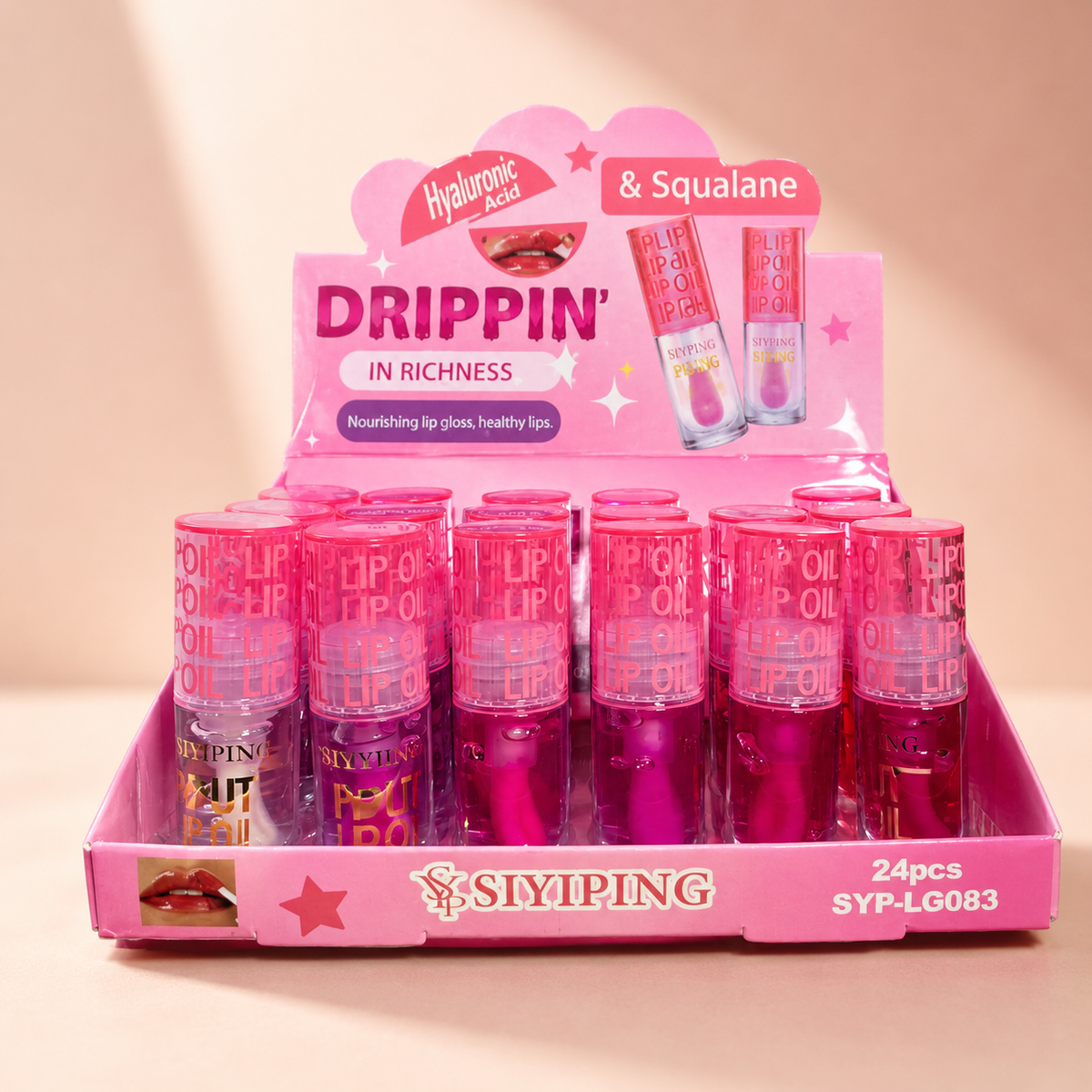 Lip Oil Drippin In Juices Siyiping en fondo rosa nude