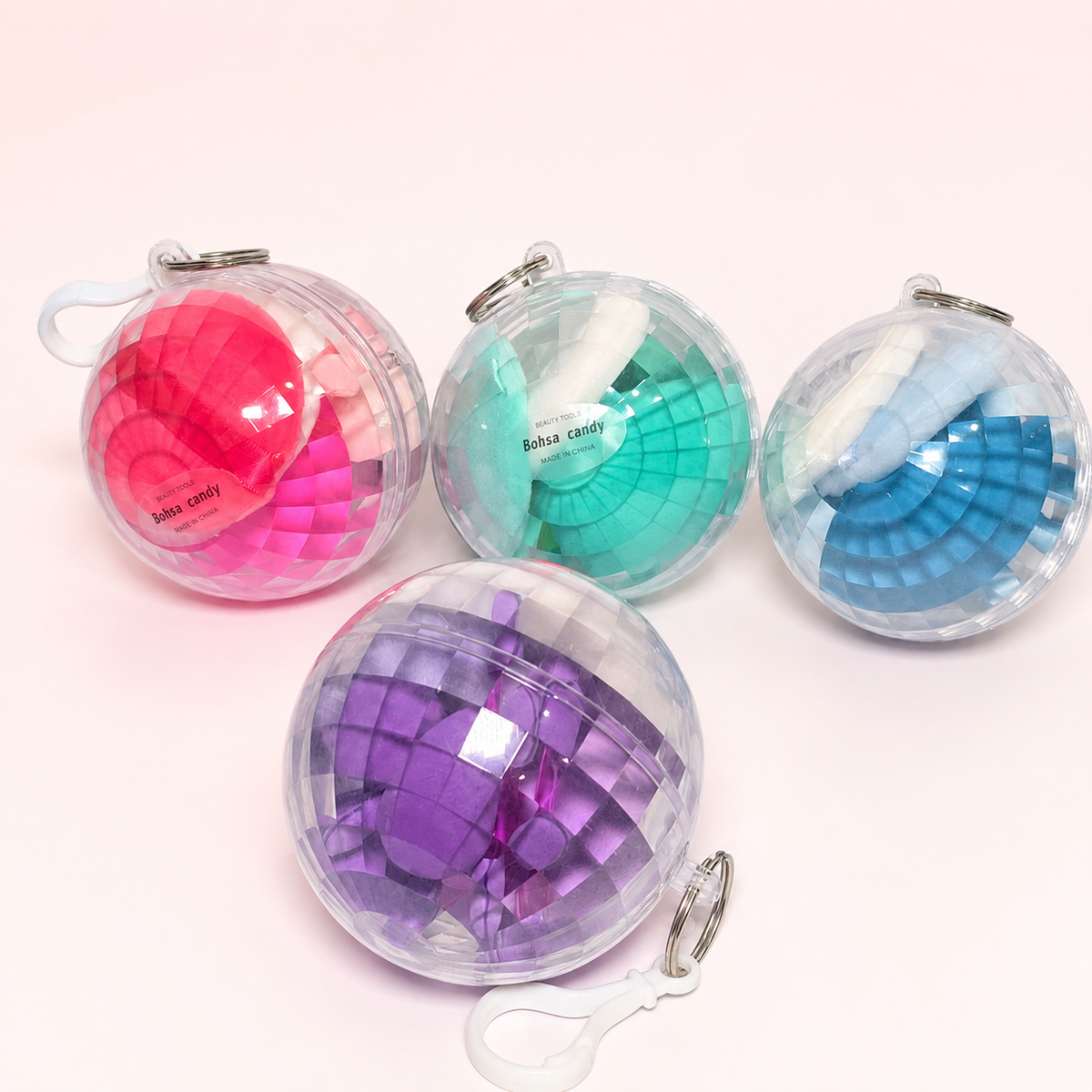 Set de esponjas en esfera transparente en cuatro colores